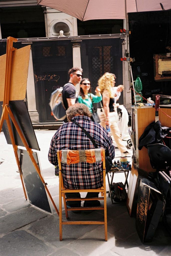 Maler in Florenz und Touristen